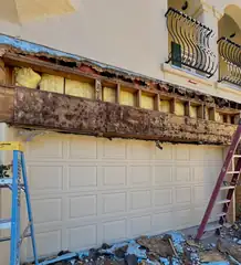 Before: Rotted beam to solid wall.