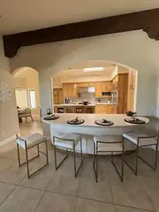 Before: Round arch to a clean, open bar.