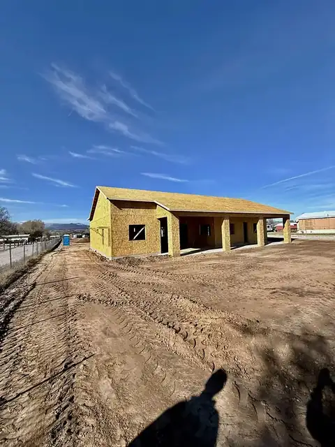 Before: Sheathing to stucco.
